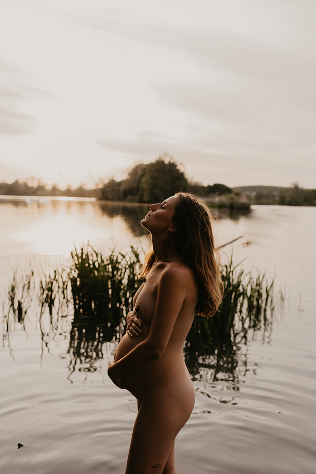 a woman having a wild pregnancy, in tune with her intuition, in the water